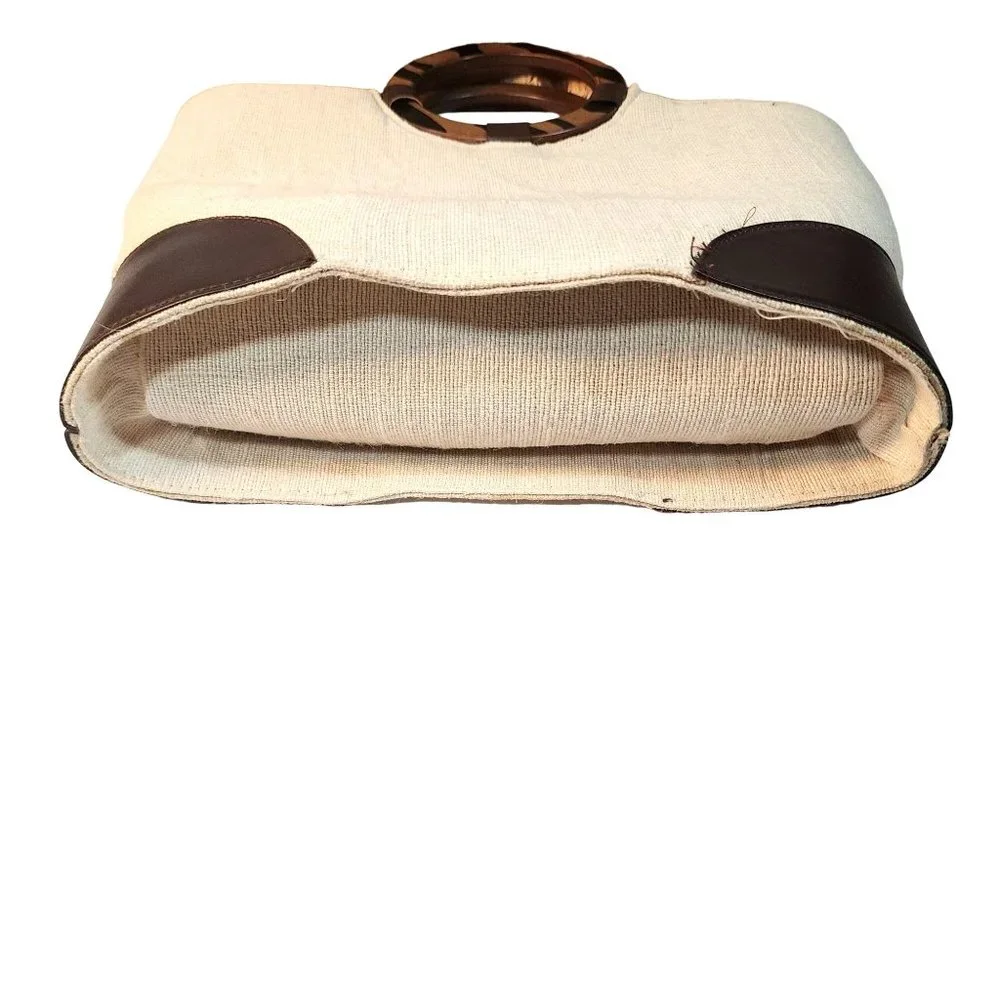 Beige Woven Handbag With Brown Accent at Bottom and Brown Decorative Wood handle